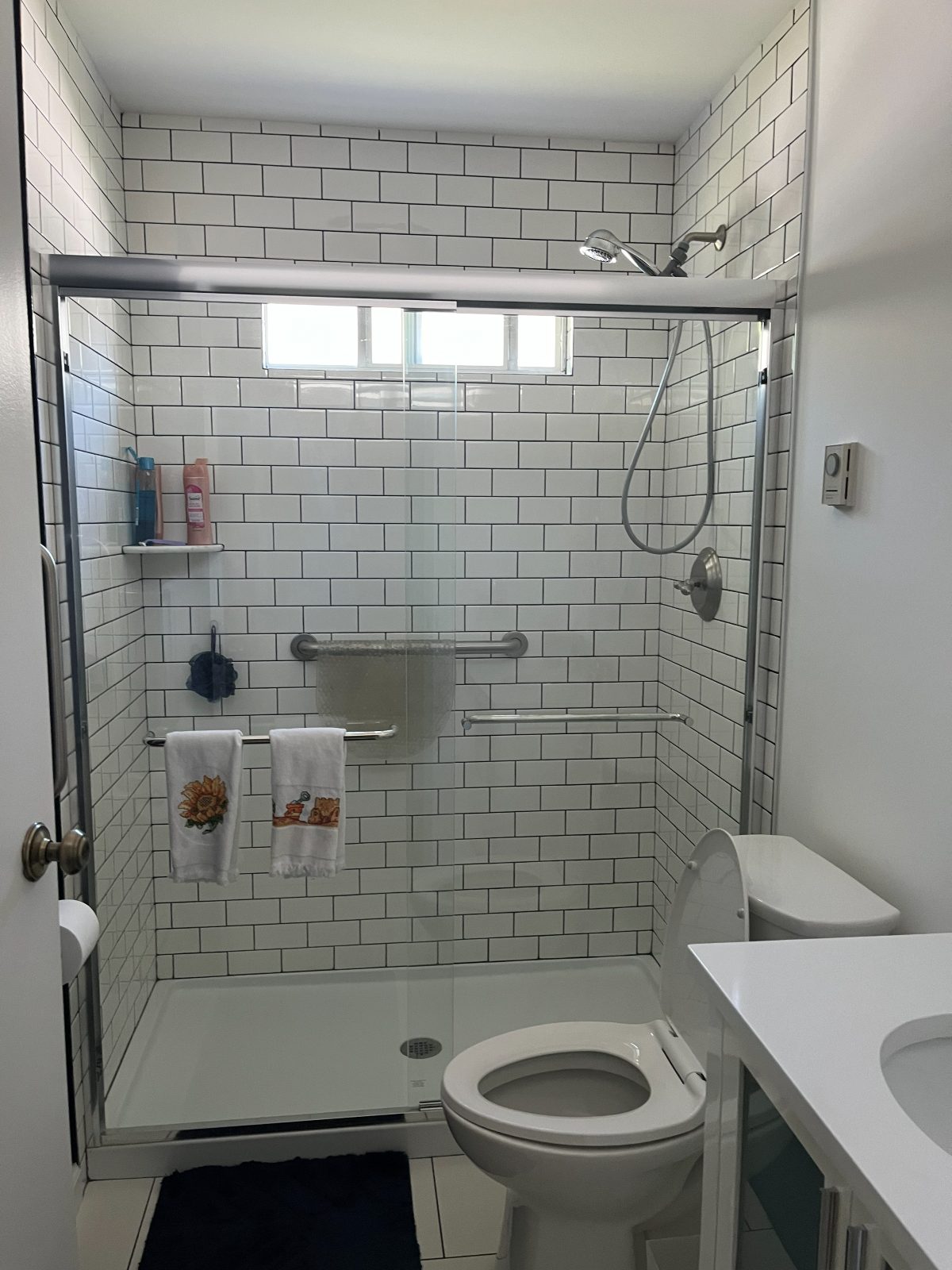 Sparkling clean bathroom with subway tile shower